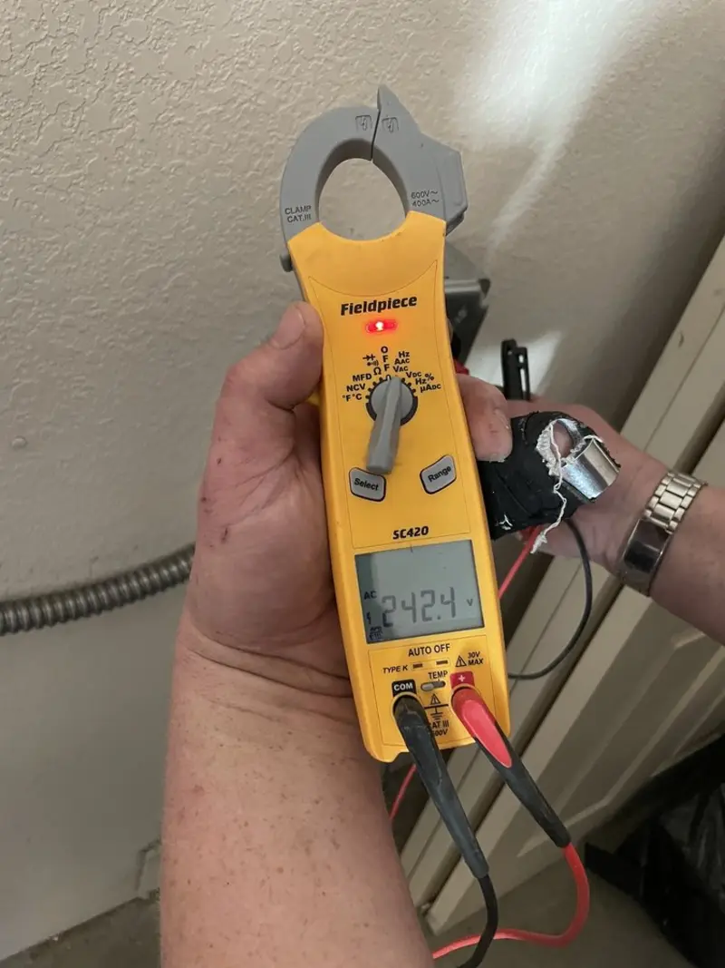 Voltage testing with clamp meter during Whole House Surge Protector in Raeford